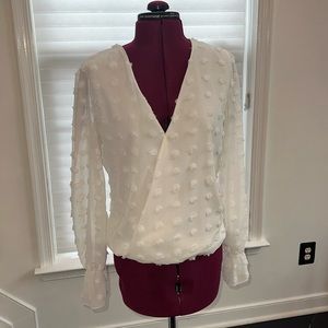White v neck blouse with 3d pom poms